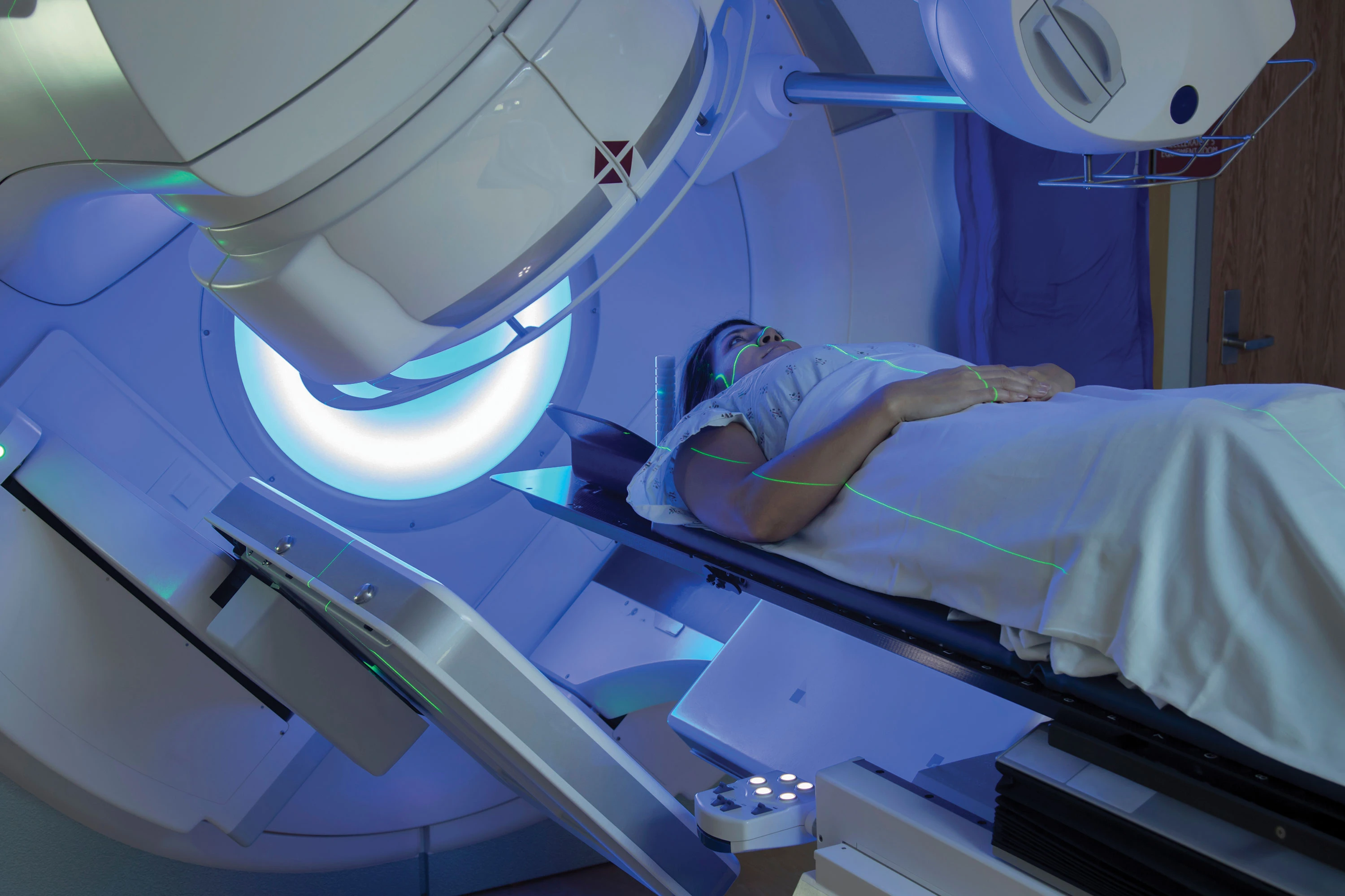 woman receiving radiotherapy treatment in machine