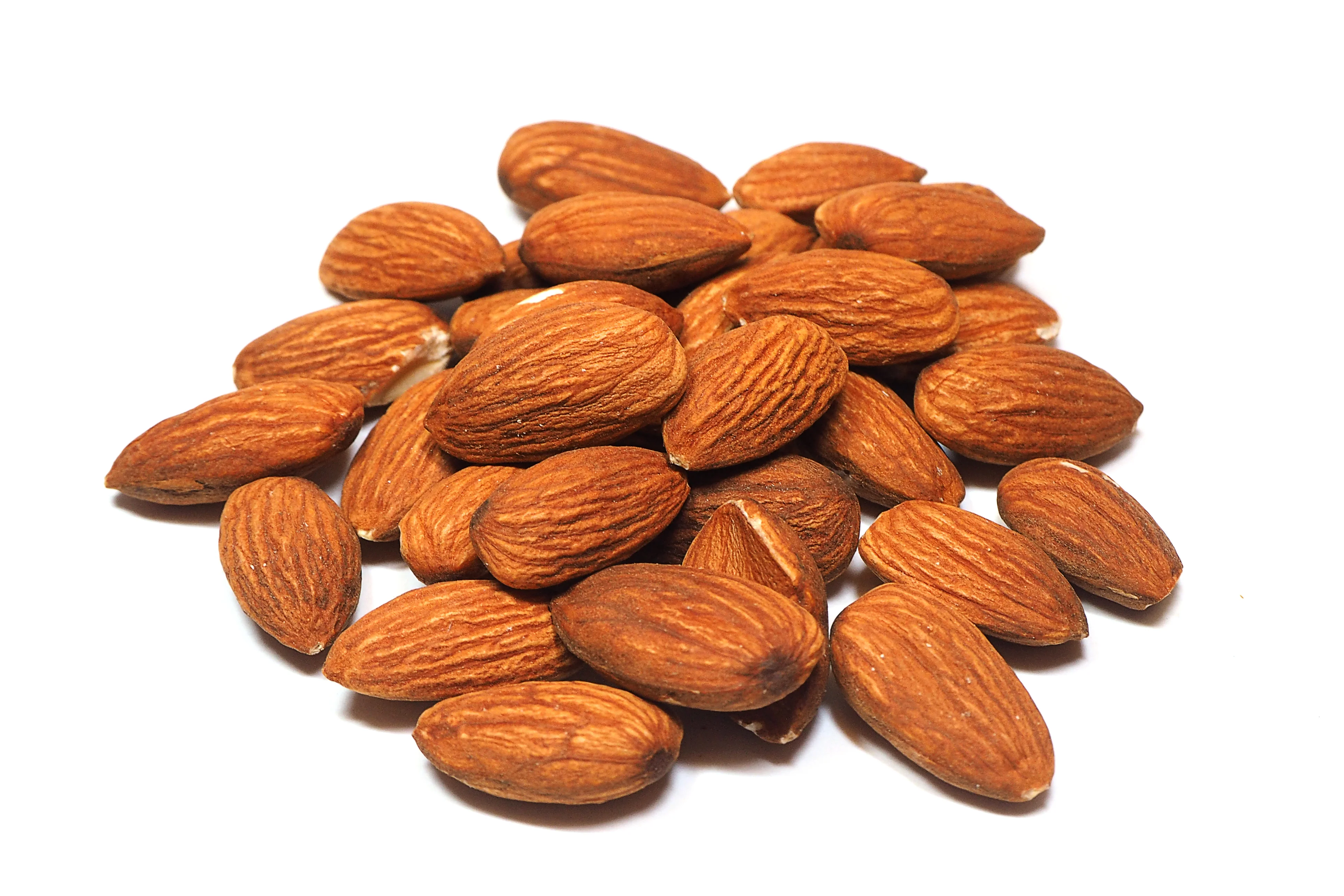 group of almonds isolated on white background